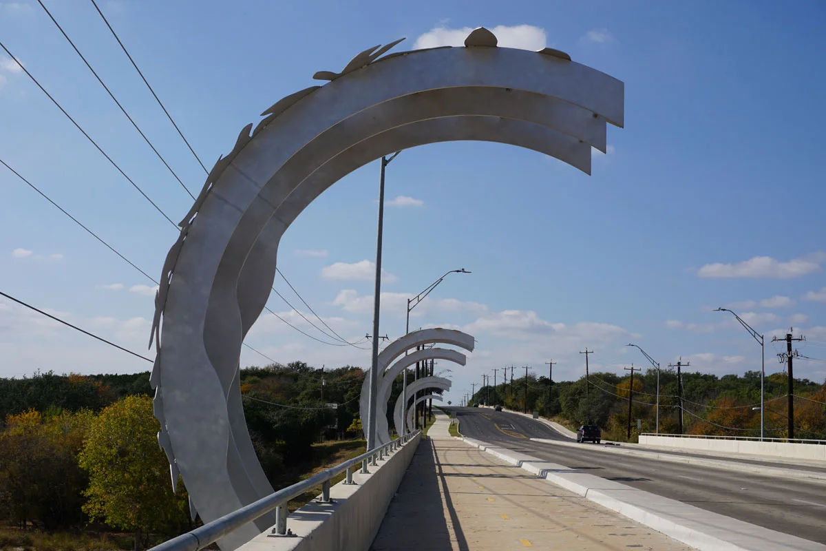 © 2017 Louise Levergneux, Leon Creek Crossing by Barbara Grygutis, a series of seven arched sculptures, evoking natural shapes, combine to form a sculptural space through which the viewer passes