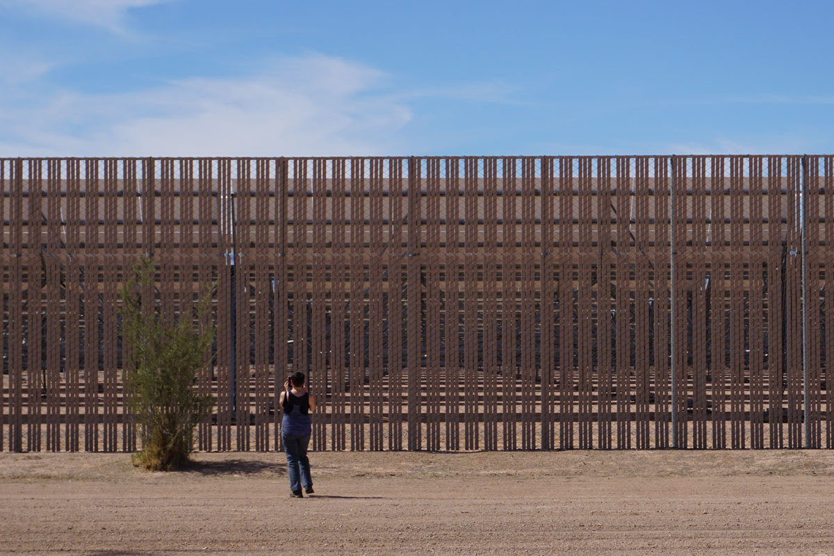 © 2018 Louise Levergneux, Flavie stealing a shot of the Solana Generating Station near Gila Bend