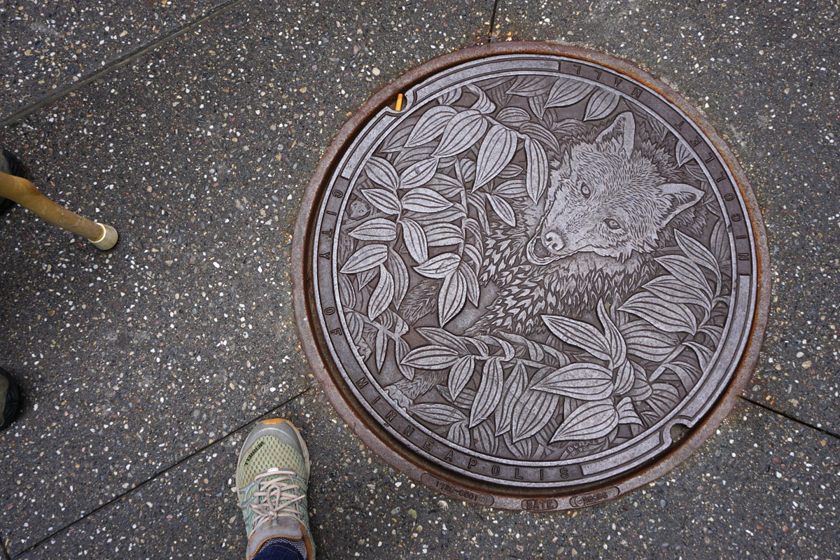 © 2018 Louise Levergneux. The Timber Wolf, manhole cover on Nicollet Mall, designed by Kate Burke.