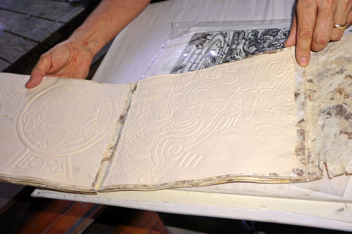 © 2018 Louise Levergneux. The bookbinding design of Touch This Art! The Book is an accordion structure that reminds us of Aztec and Mayan codices. The 100% cotton, handmade cast paper pages in light pink/red hue is from iron oxide. The pages are mounted on a lengthy piece of amate (a type of bark paper) paper.