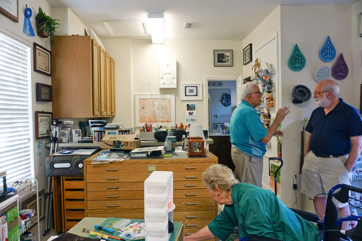 © 2018 Louise Levergneux. Al talking about Bobbi’s work with Michael as Bobbi explains her sculpture relief Florida Citrus 467-1 .