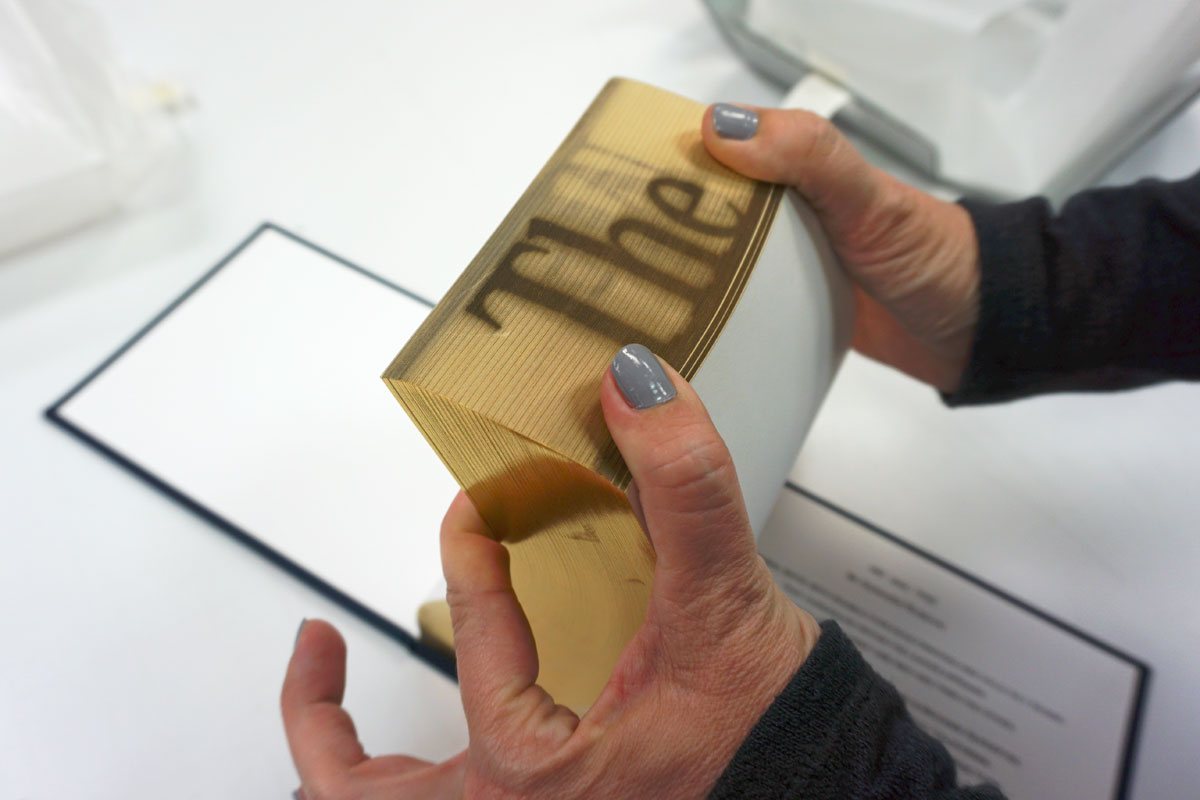 © 2019 Louise Levergneux. Kristin demonstrates Ed Ruscha’s artists’ book ME and THE.