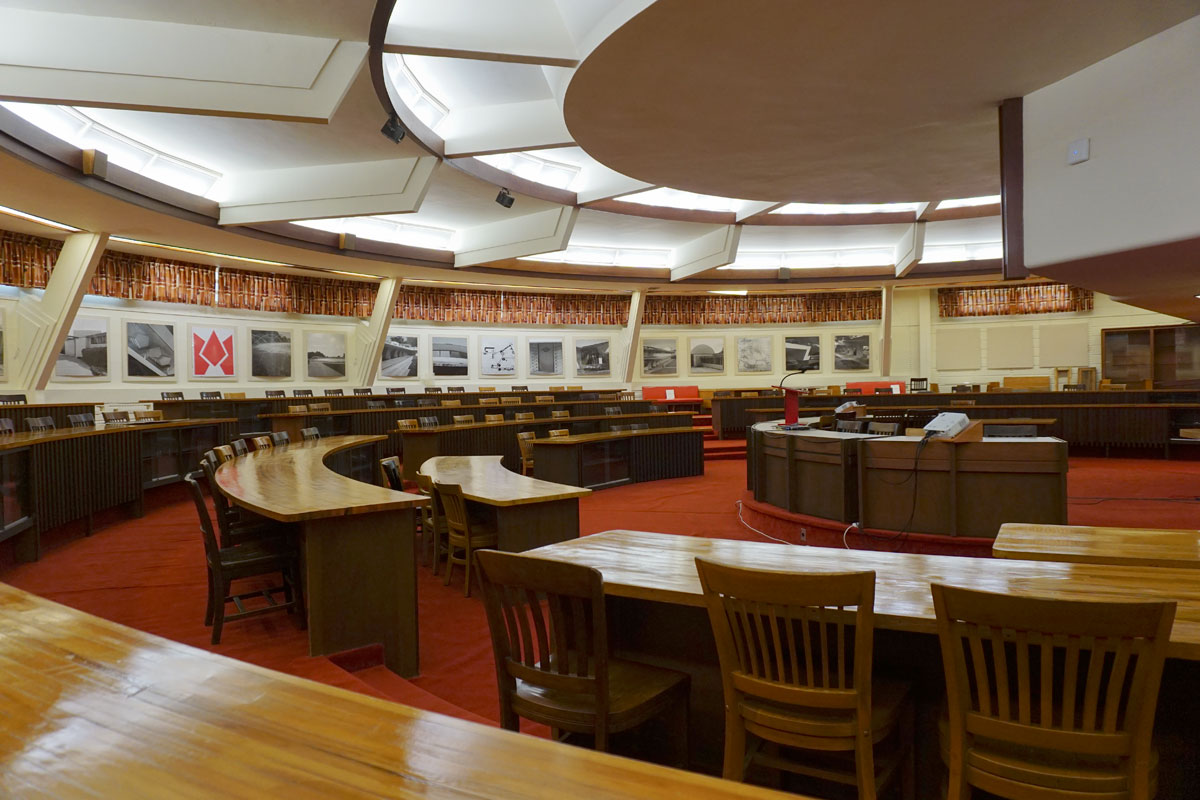© 2019 Louise Levergneux. The circular William Hollis Room of the E. T. Roux Library, is currently used for lectures. It contains the original desks, and features clerestory windows and “light wells,” that admits light from skylights all the way to the bottom floor.