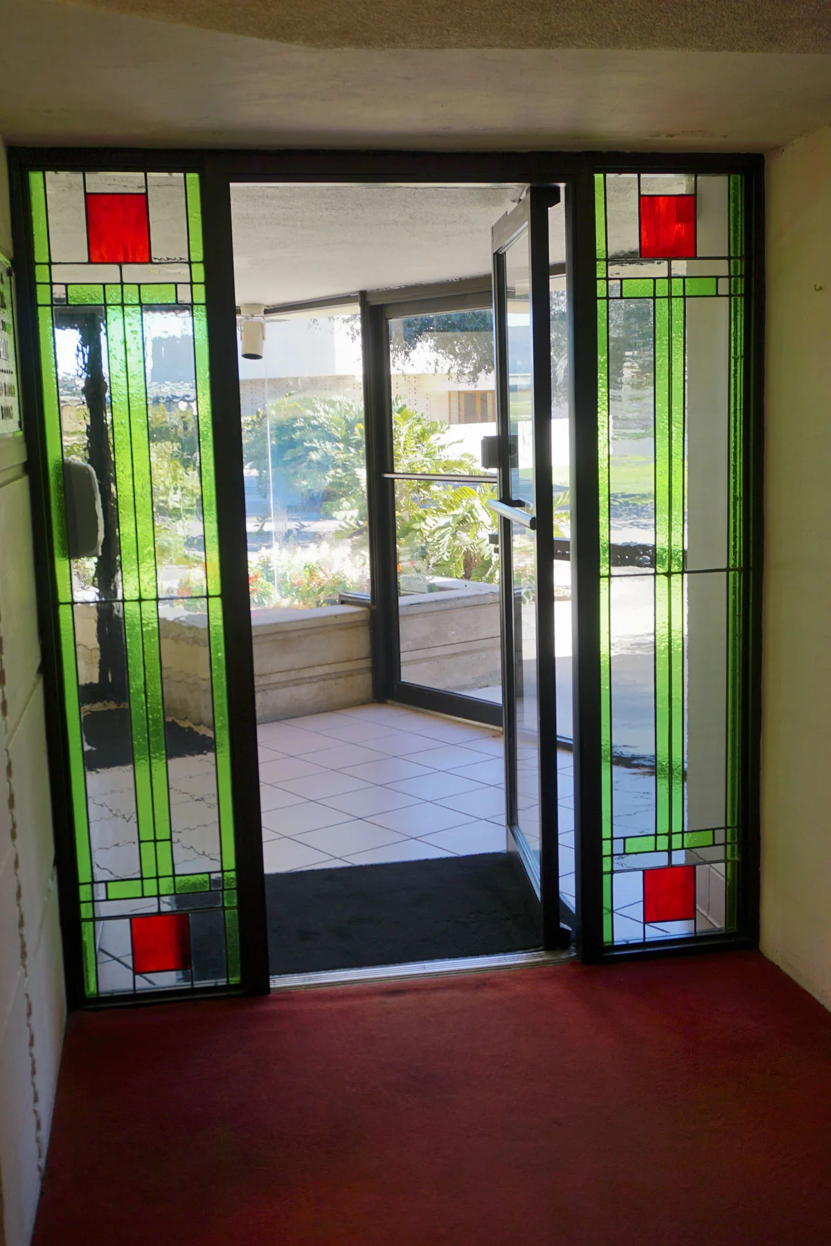 © 2019 Louise Levergneux. The stained glass front door of the E. T. Roux Library.