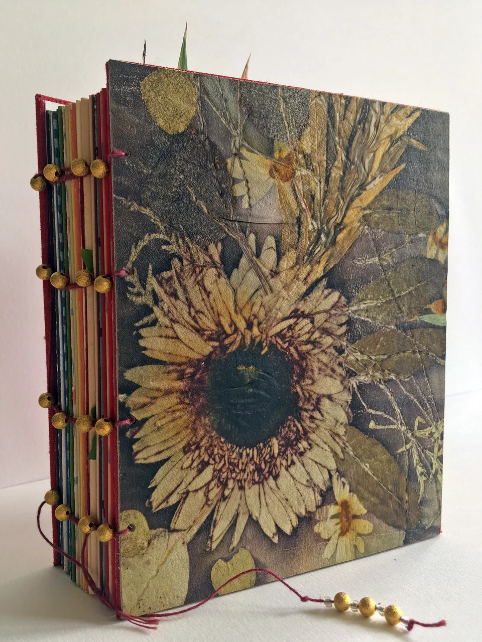 © 2019 Merike van Zanten. Gerbera Daisy, coptic bound notebook with eco printed leather cover from Merike’s residency,