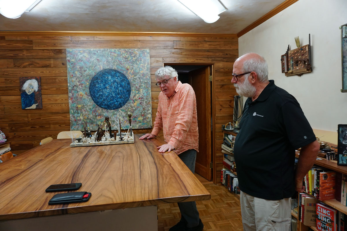 © 2019 Louise Levergneux. A gallery tour in Olivia Primanis and Christopher Hines home. Christopher talking art with Michael Sutton.