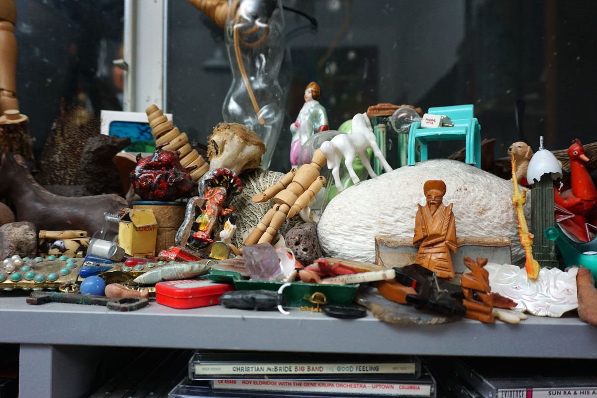 © 2019 Louise Levergneux. Fascinated by various small items adorning the shelves in Christopher’s studio.