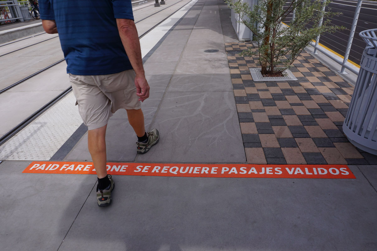 © 2019 Louise Levergneux. Michael crossing the line to view Creosote Lace at he 50th Street Light Rail Station.