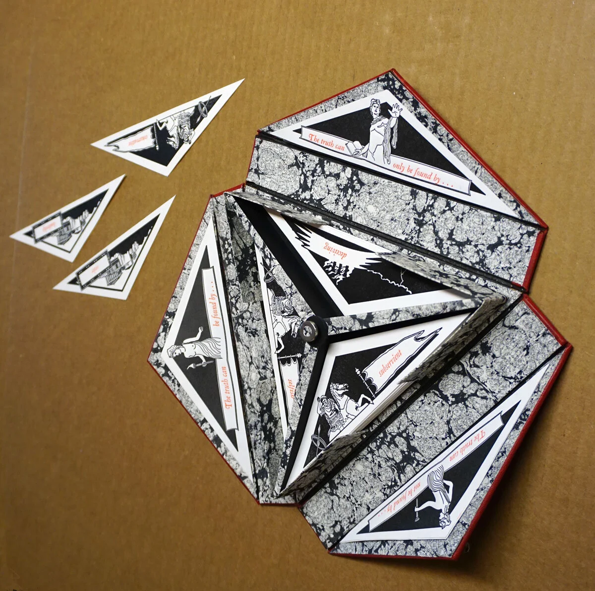 © 2019 Louise Levergneux. Reason Belief Truth by Thomas Parker Williams ; laser cut painted with ink and watercolor; letterpress printing (hand-set type, polymer plates) by Mary Agnes Williams; marbled paper.