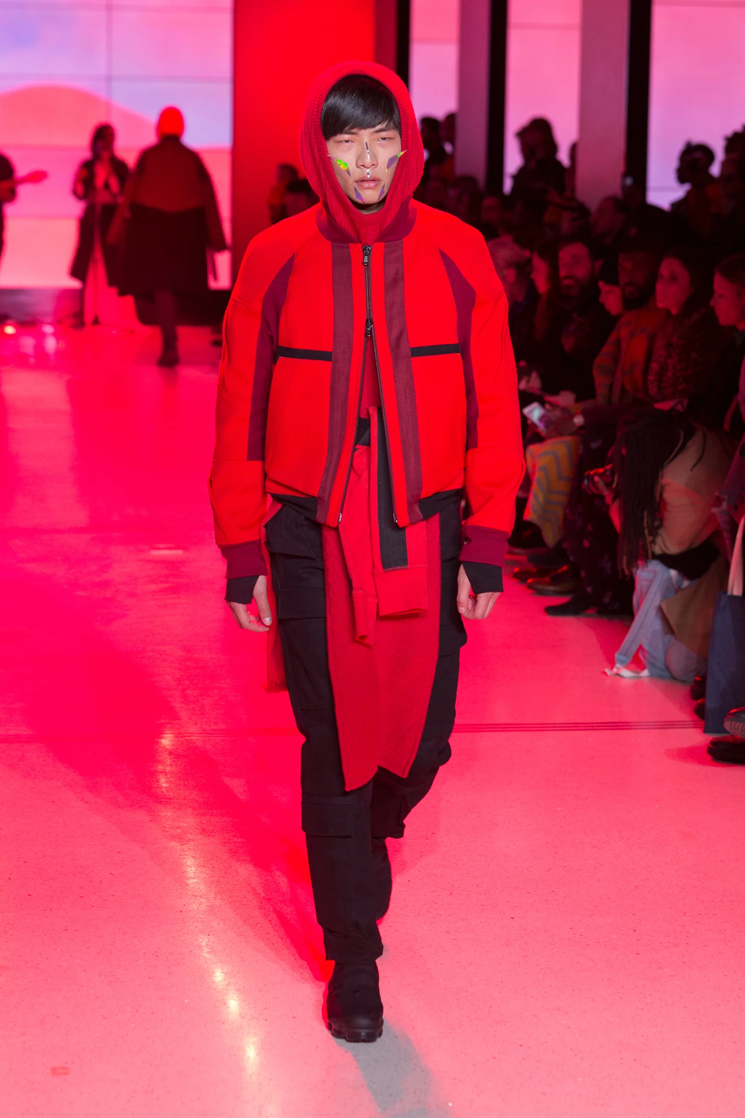 LOOK 19 ARC Flight Jacket / Crimson Red ARC Hooded Tunic / Red ARC Long Sleeve Tee / Black ARC Long Sleeve Tee (Worn on Waist) / Crimson Red ARC Tactical Pant / Black Denim Nike Air VaporMax Utility