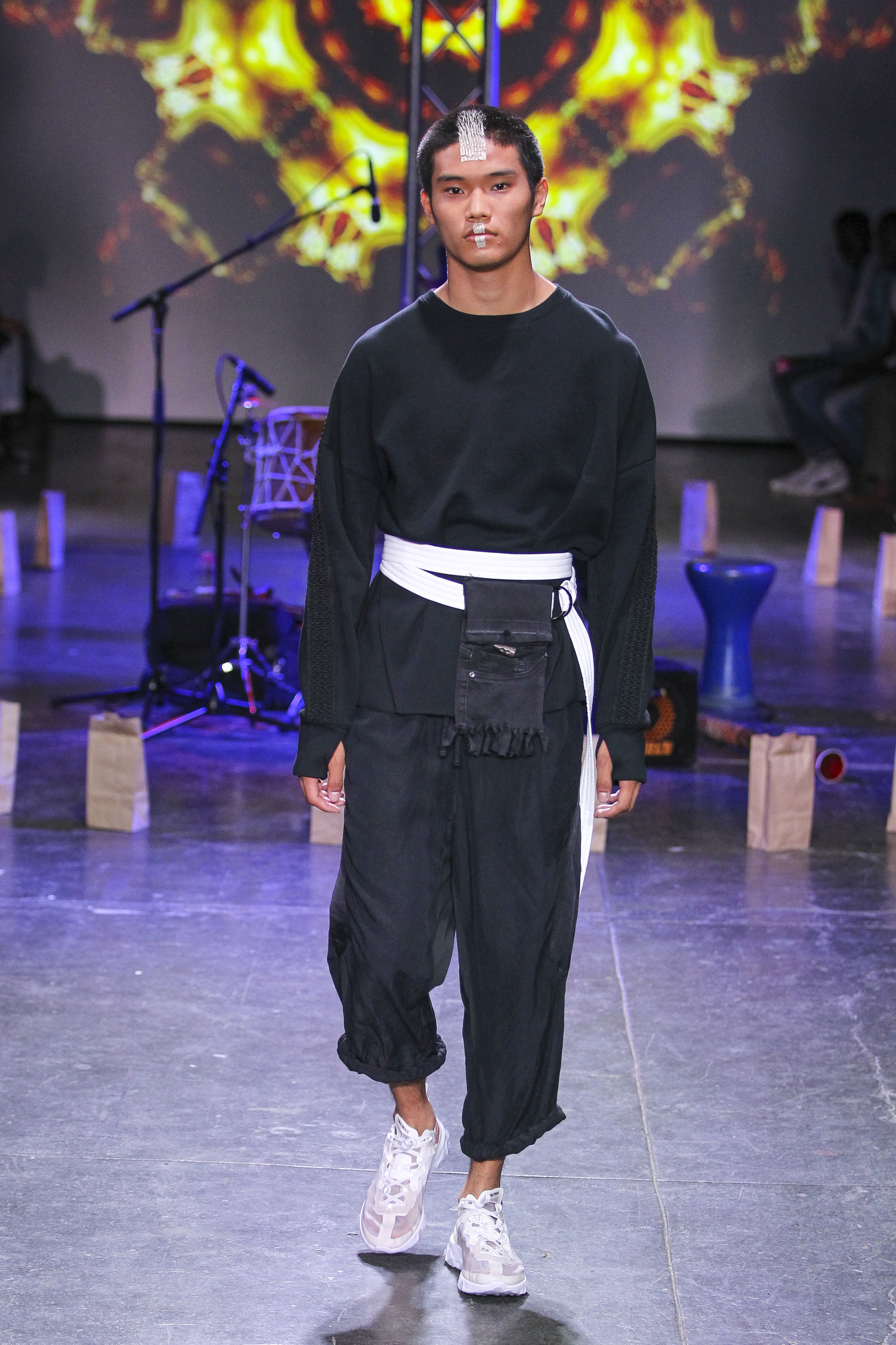  LOOK 12   ARC Desert Sweatshirt  / Black   ARC Taos Pant  / Black   ARC Wrap Belt  / White   ARC Shoulder Bag  (Worn on Belt)   Nike React Element 87  