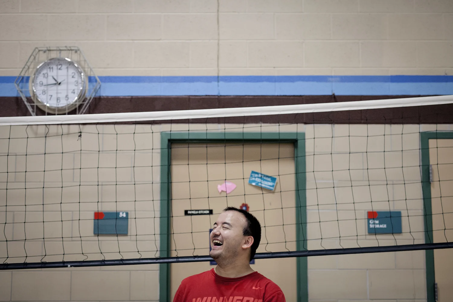 Flint, MI - Thursday, June 25, 2015: Stephen Miller from Flushing, MI laughs as he waits to participate in training drills during practice at the Elmer A. Knopf Learning Center in Flint, MI. The Michigan Special Olympics Volleyball Team has been preparing for the 2015 Special Olympics Summer Games in Los Angeles, CA beginning July 25. (Tim Galloway for ESPN)