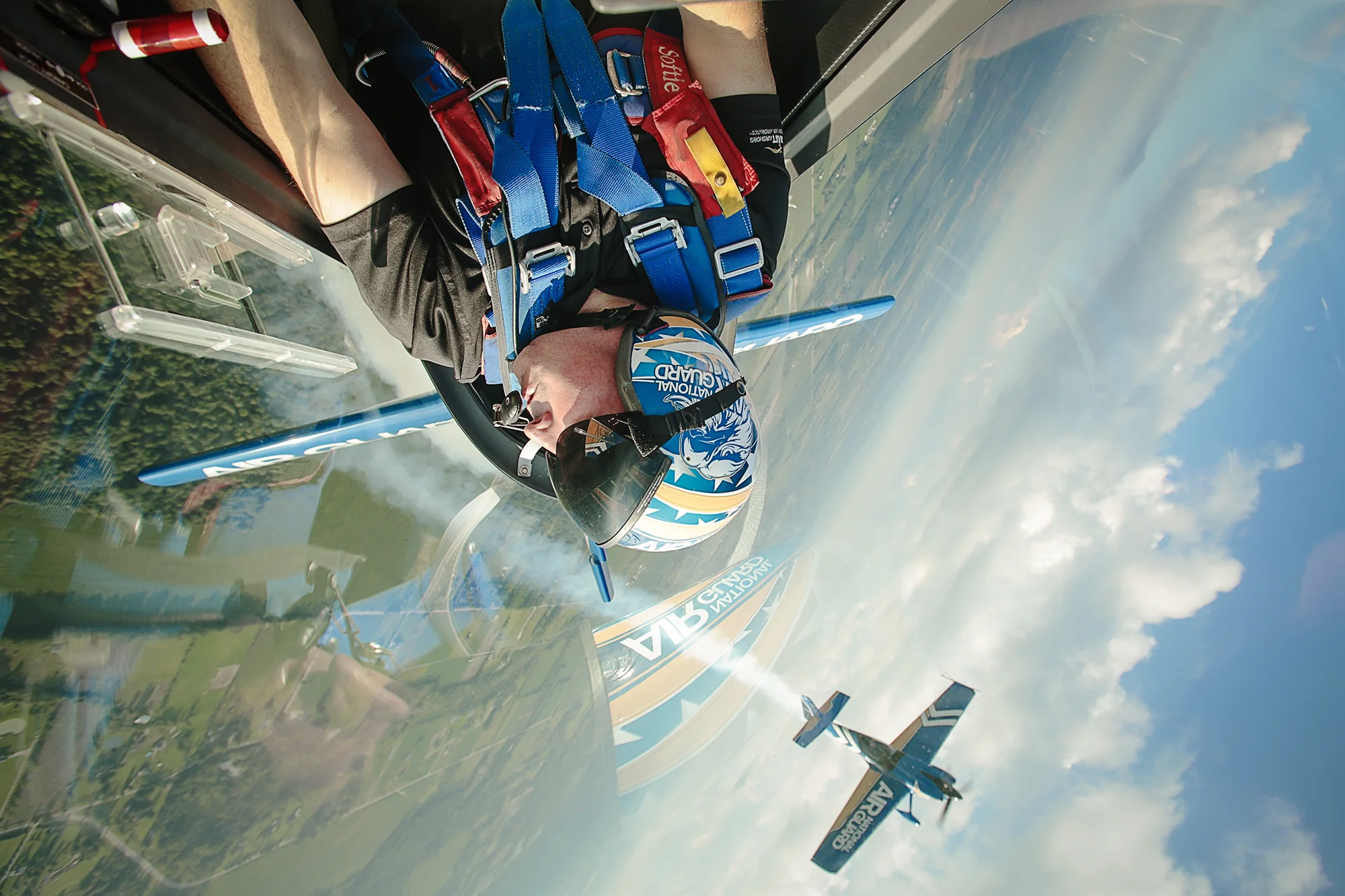 Ltc. John Klatt from Lakeville, MN pilots the Air National Guard Extra 300L while an Air National Guard MXS files near by on Wednesday, Sept. 3, 2014 at the Romeo State Airport in Romeo. Tim Galloway/Special for DFP
