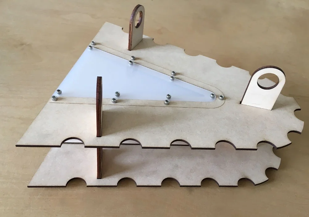Quick laser cut prototype to observe alignment grooves and cable suspension tabs.