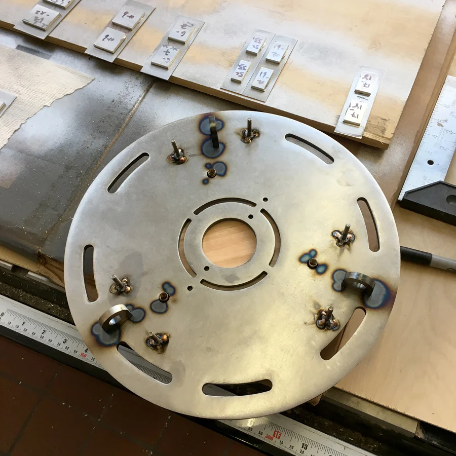 Welding the stainless steel ceiling mounting plate.