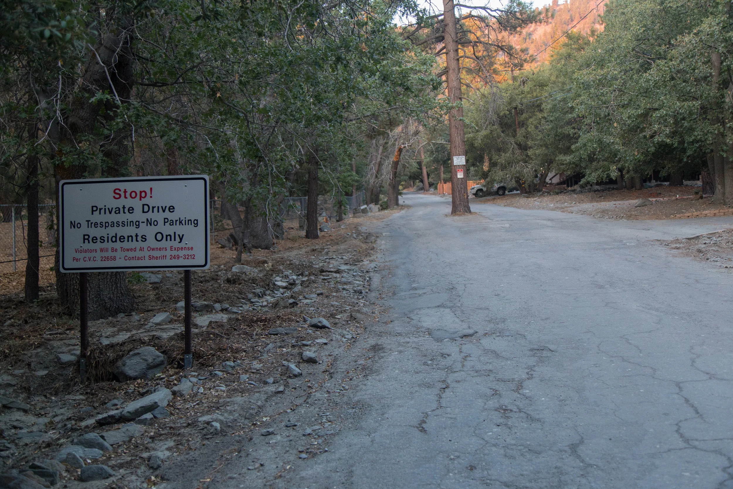 Begin the trek by hiking up the steep Acorn Drive for about 3/4 miles. Do not park past the sign. This is private property. There is a turn out just before the sign on the right hand side of the road that fits two cars. Display your adventure pass and be on your way while being respectful of the residents.