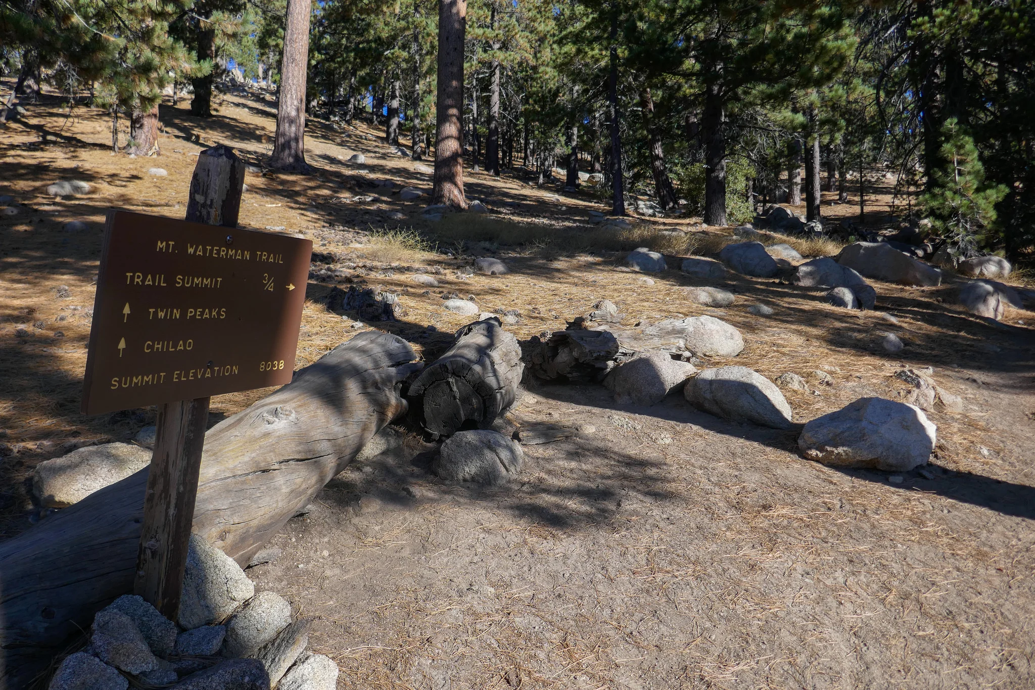 Sign leading up to the peak.