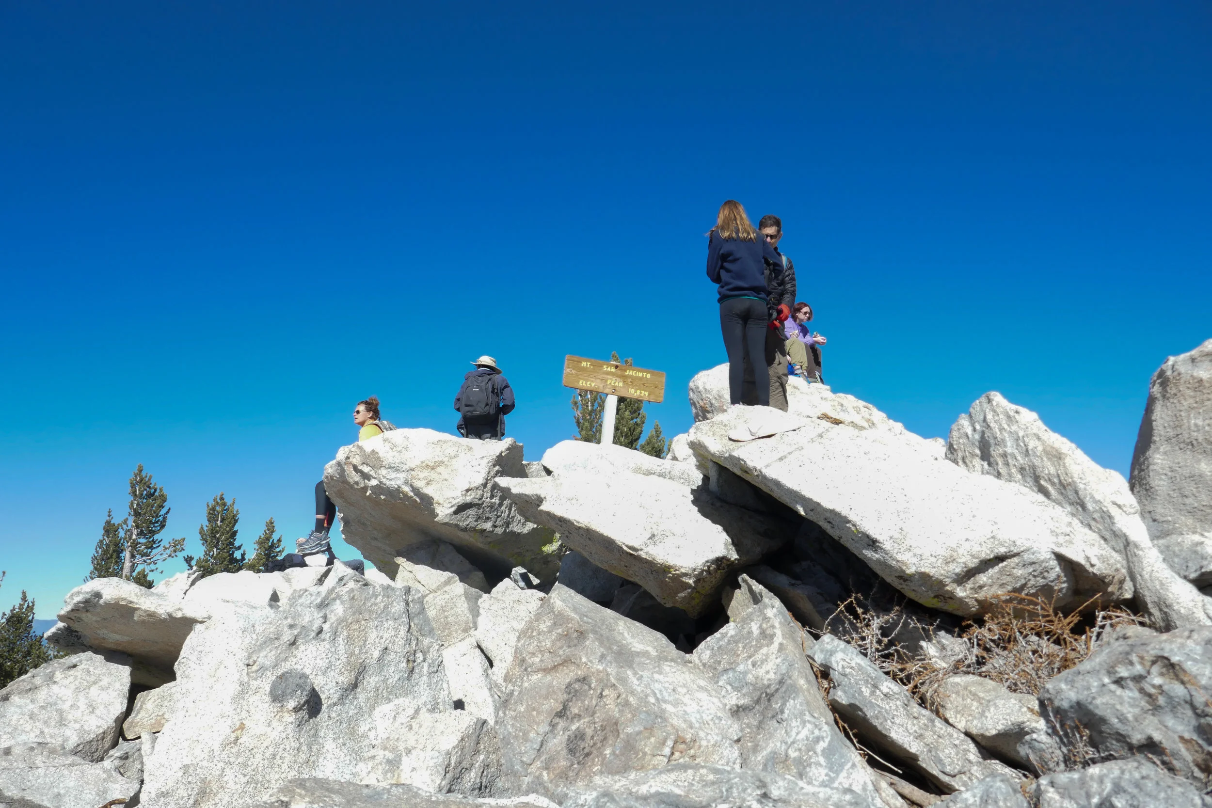 People hanging out at the summit sign getting their pictures. The views from up there were pretty incredible. 