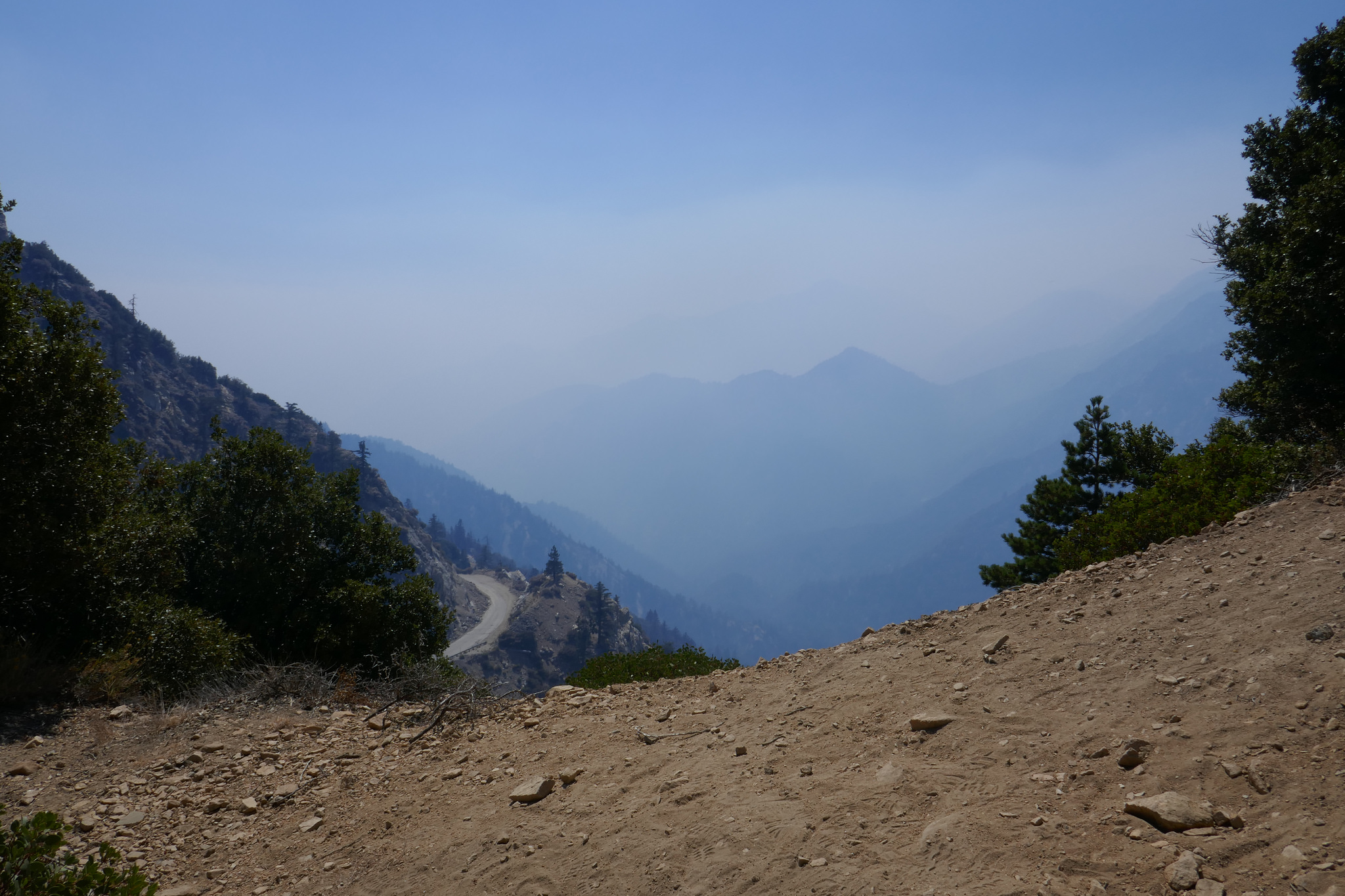 I climb up to a look out point that faces south towards Highway 39. Smoke fills the canyon.