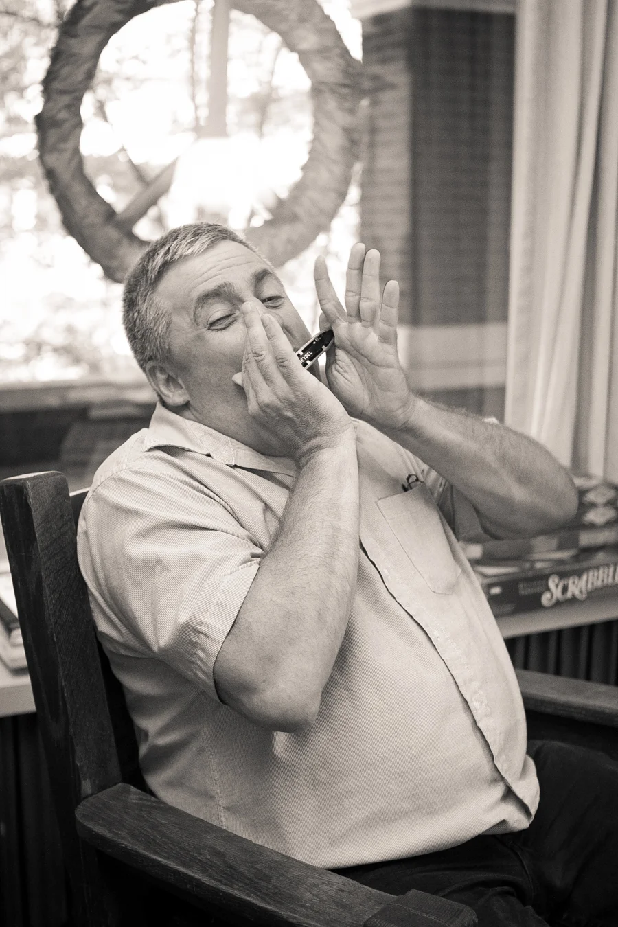 Patrick, playing harmonica during our recording session for his episode of Poetry Spoken here.