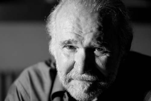 Poetry Spoken Here Host, Charlie Rossiter, caught contemplating deep poetic mysteries.
