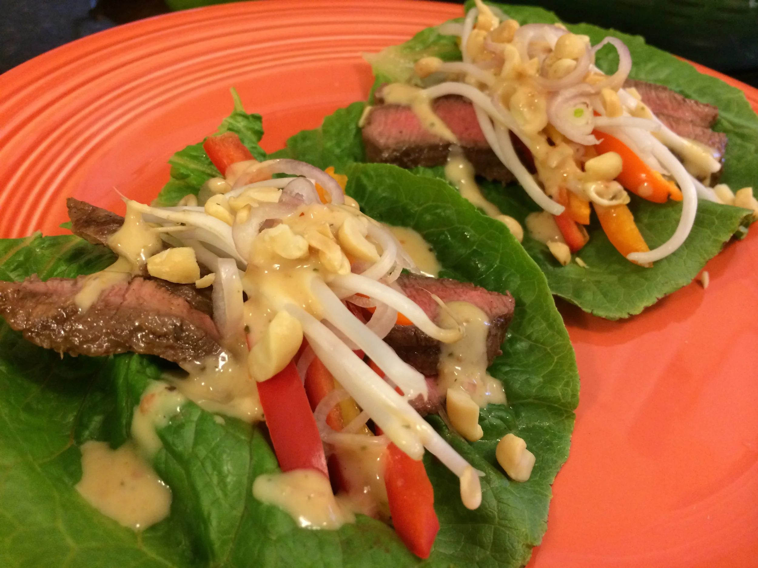 Asian Steak Lettuce Wraps with Spicy Thai Peanut Butter Vinaigrette. Better fire up the grill...