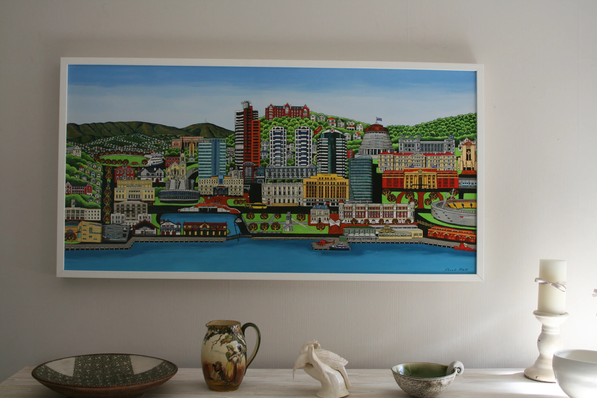 Stretched canvas with white frame.