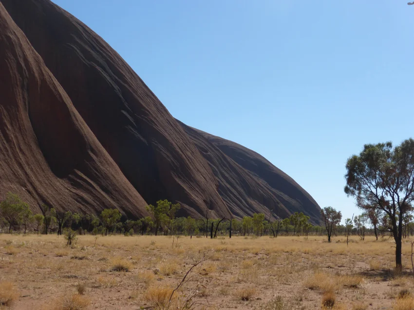 As our guide drove us toward the base of Uluru, he explained the spiritual and cultural significance of these two sacred places to the Anangu. During their 23,000 years - these were places of meeting, worship and ritual.