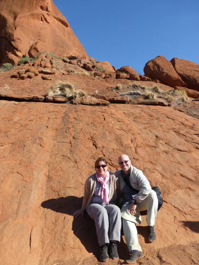 Many visitors have come to Uluru to climb to the top. Over the years, the Anangu people have begun to ask tourists to stop climbing on their sacred ground. This is a huge controversy (even today) between the tourist industry and the Anangu. We chose not to climb (also, thankfully, it was too windy so the climb was closed - made our decision even easier). This is a picture of us at the base.