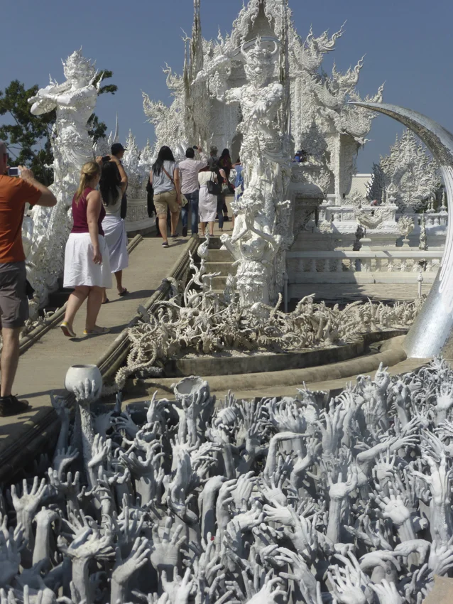 Wat Rong Khun also known as the White Temple is the newest
temple in Thailand. The temple, designed by artist, Chalermchai Kosipitpat, combines
historical elements of Buddhism with images of Michael Jackson, Superman,
September 11th and Angry Birds—unfortunately we were not allowed to photograph
the inside, which is still being painted.
0
0
1
51
291
Kikio Creative Communications
2
1
341
14.0
Normal
0
false
false
false
EN-US
JA
X-NONE
/* Style Definitions */
table.MsoNormalTable
{mso-style-name:"Table Normal";
mso-tstyle-rowband-size:0;
mso-tstyle-colband-size:0;
mso-style-noshow:yes;
mso-style-priority:99;
mso-style-parent:"";
mso-padding-alt:0in 5.4pt 0in 5.4pt;
mso-para-margin:0in;
mso-para-margin-bottom:.0001pt;
mso-pagination:widow-orphan;
font-size:12.0pt;
font-family:Cambria;
mso-ascii-font-family:Cambria;
mso-ascii-theme-font:minor-latin;
mso-hansi-font-family:Cambria;
mso-hansi-theme-font:minor-latin;}
