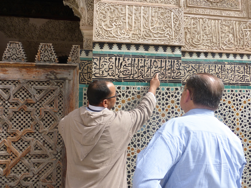 Ahmed teaching John how to read Arabic.