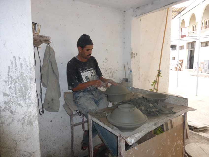 A potter creating another beautiful piece.