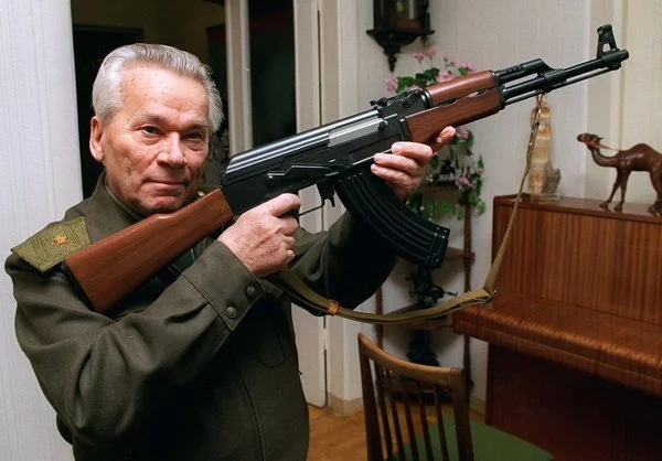 Lt. Gen. Mikhail T. Kalashnikov with a model of the AK-47 in 1997. ( Vladimir Vyatkin/Associated Press)