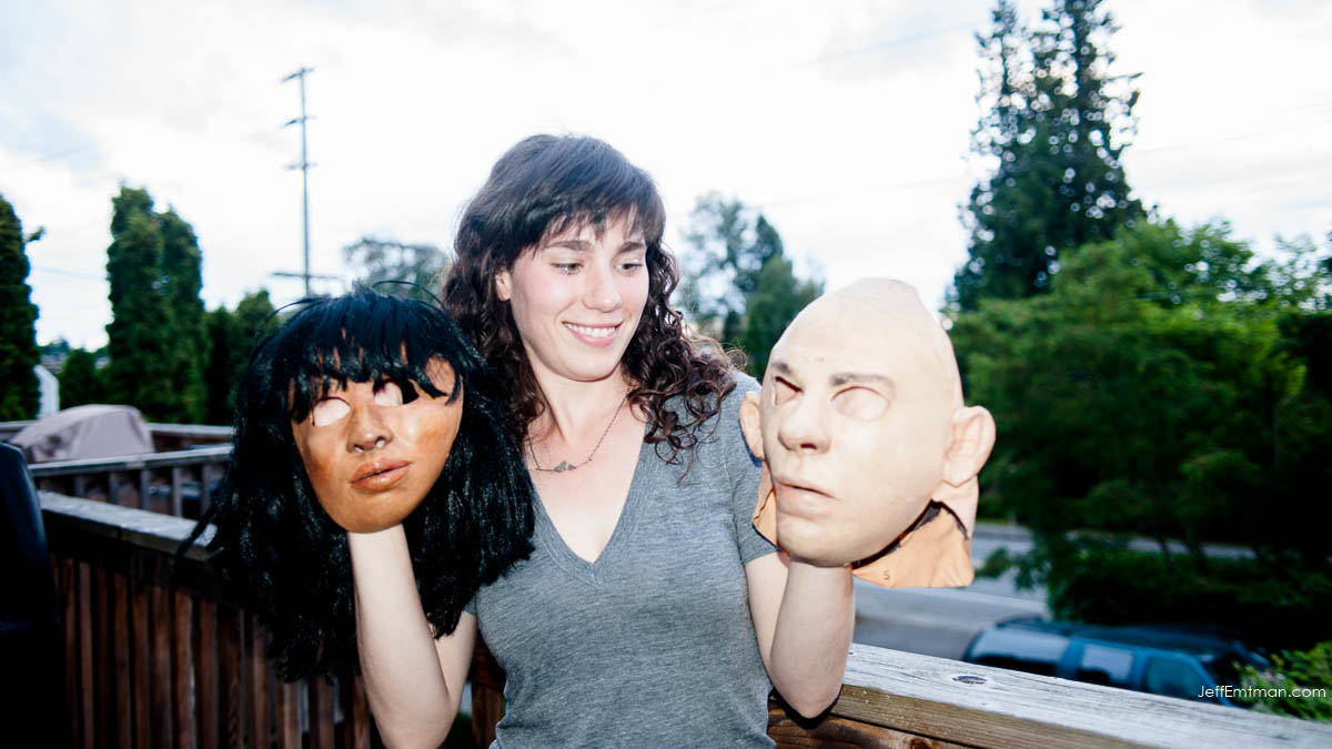  Crow Researcher Kaeli Swift holding two masks used in crow research projects in and around Seattle, Washington. 