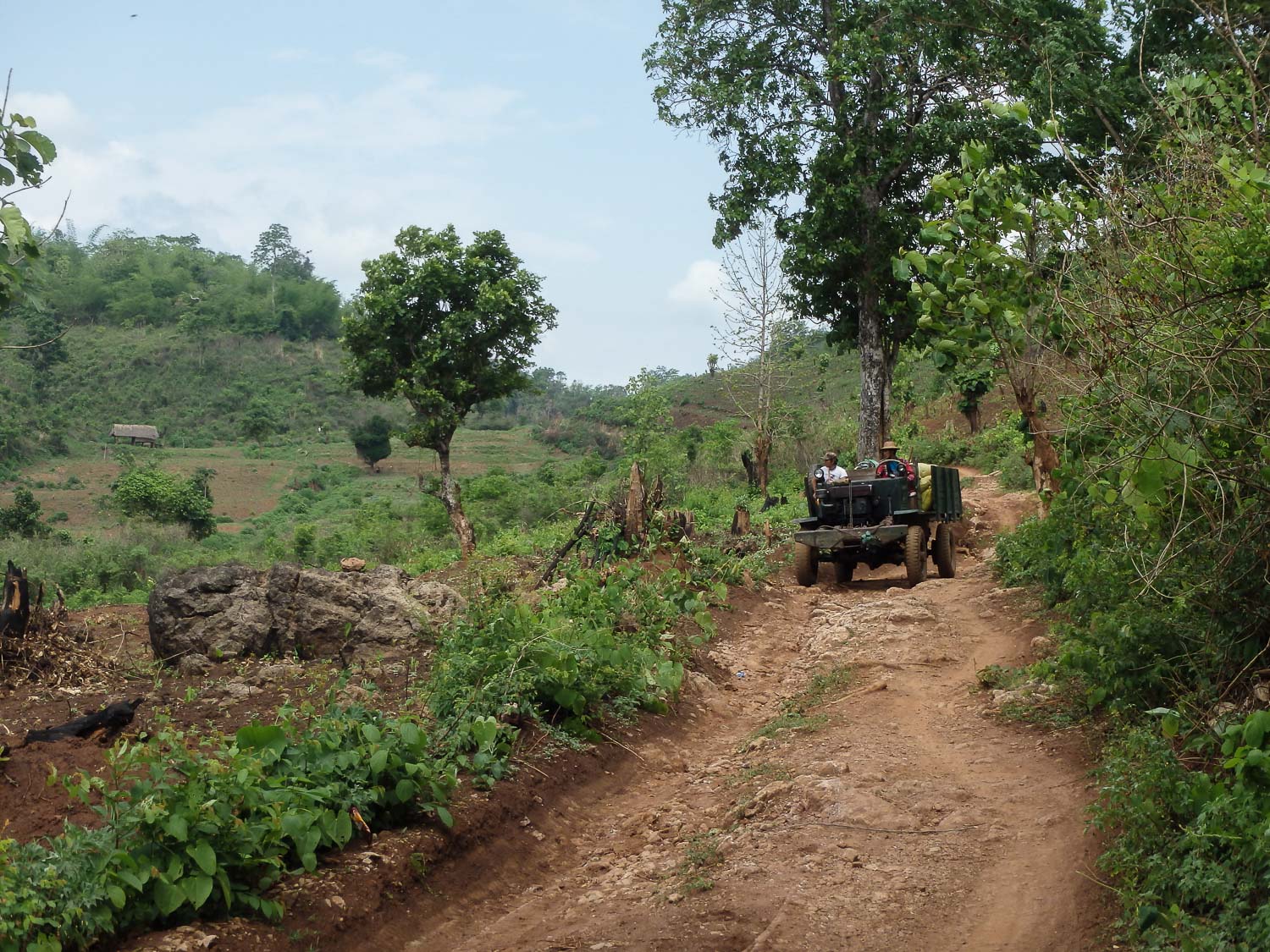 Trucks traveling on bumpy, dirt roads