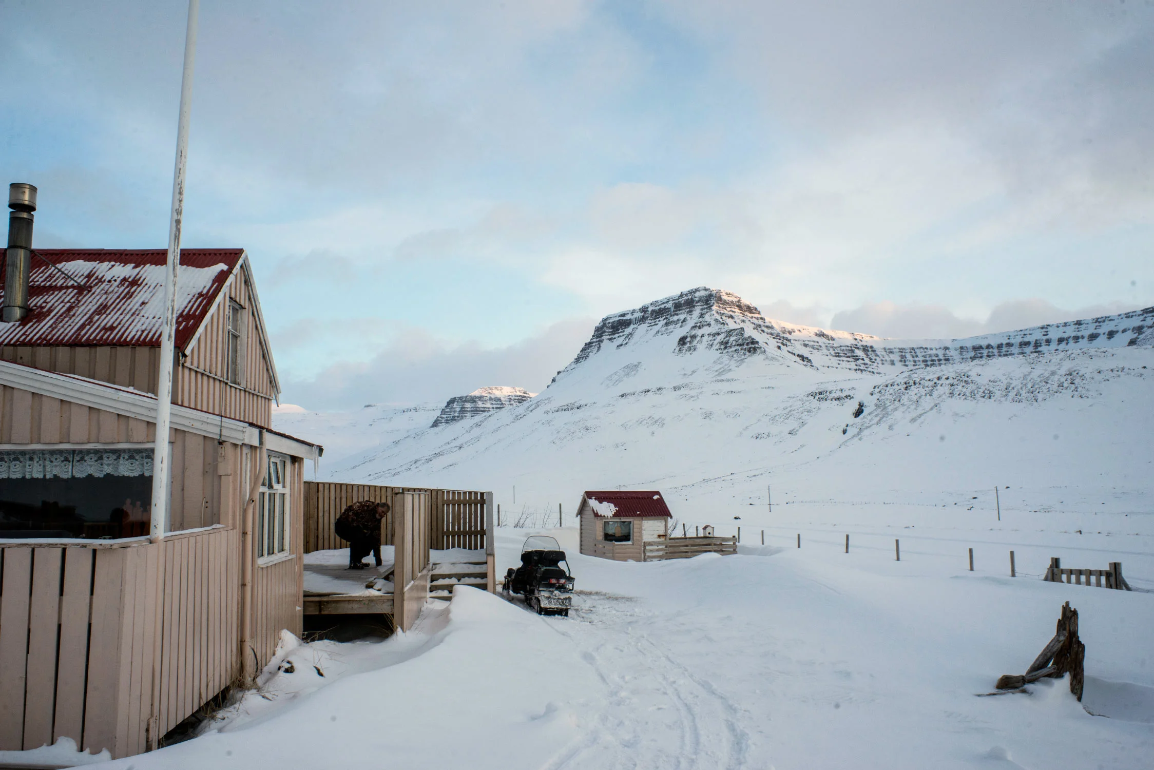 An Icelandic hunter, Jóhann Hannibalsson, at a remote cabin where he intends to shoot a fox.