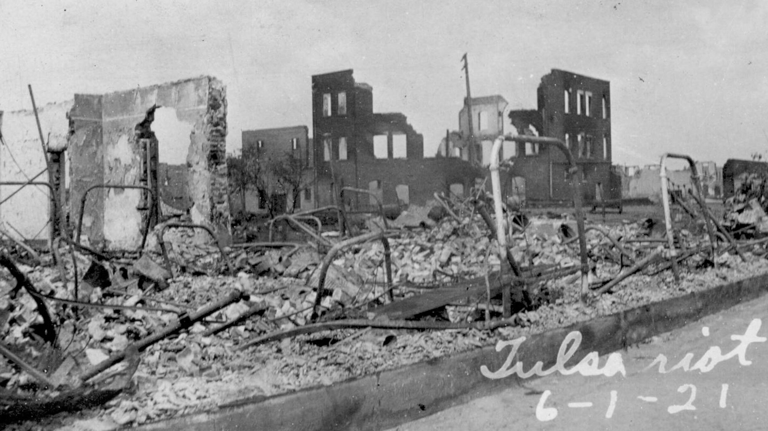   Iron bed frames in the rubble of burned buildings after the Tulsa Race Riot . Used with permission from the  Oklahoma Historical Society  