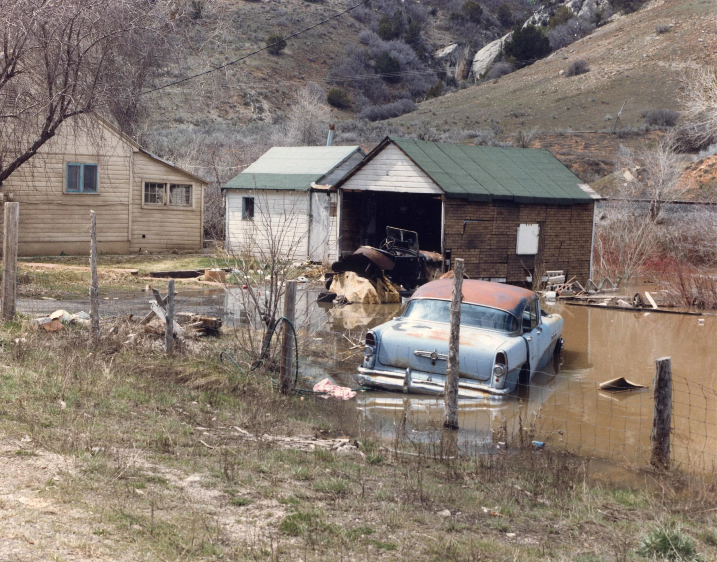 Thistle slowly being submerged by Thistle Lake in April 1983. Photo courtesy of the Utah State Archives and Records Service.