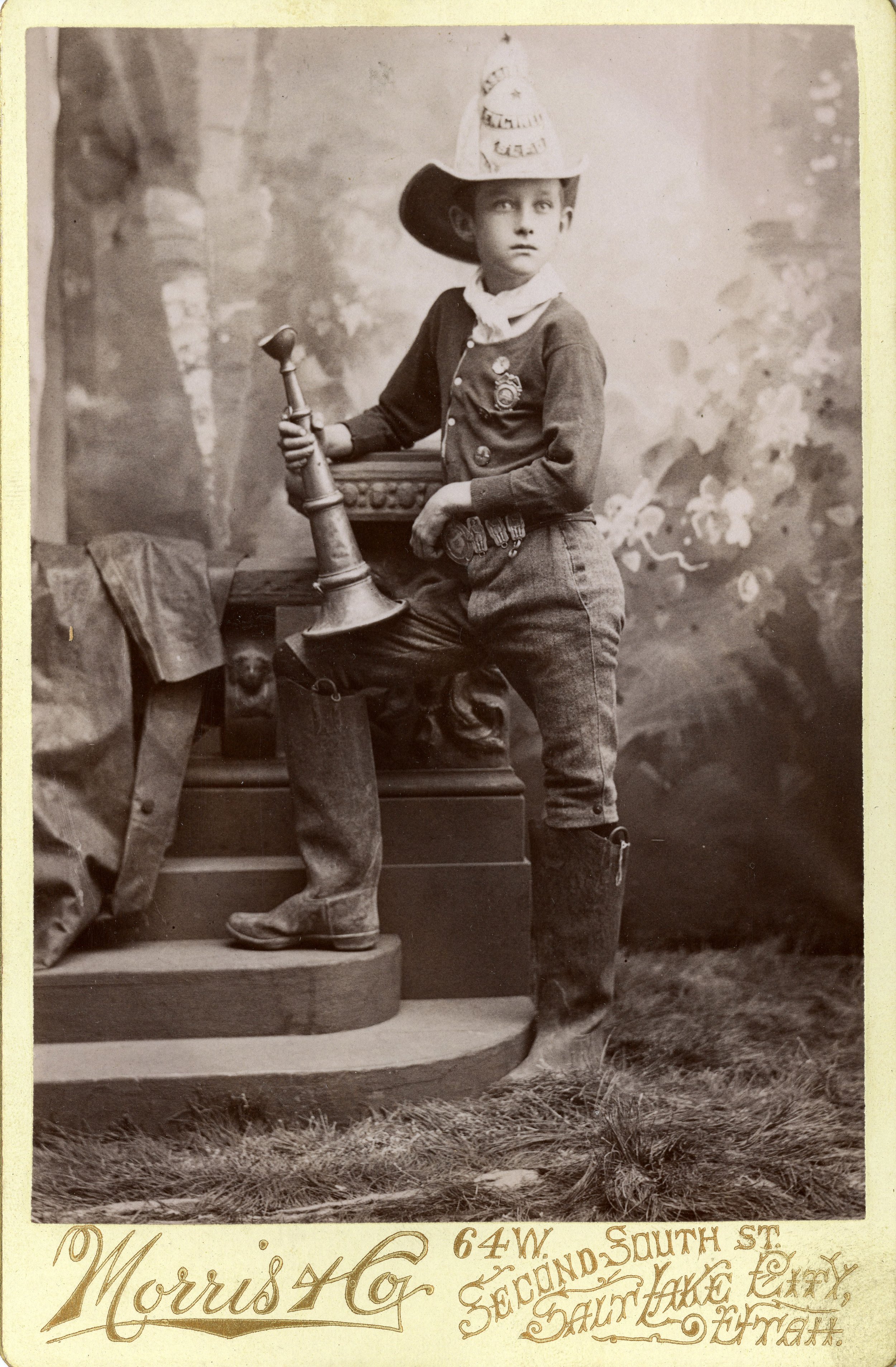 UNIDENTIFIED BOY IN FIRE FIGHTER UNIFORM (SERIES 23526). IMAGE COURTESY OF THE UTAH STATE ARCHIVES AND RECORDS SERVICE.