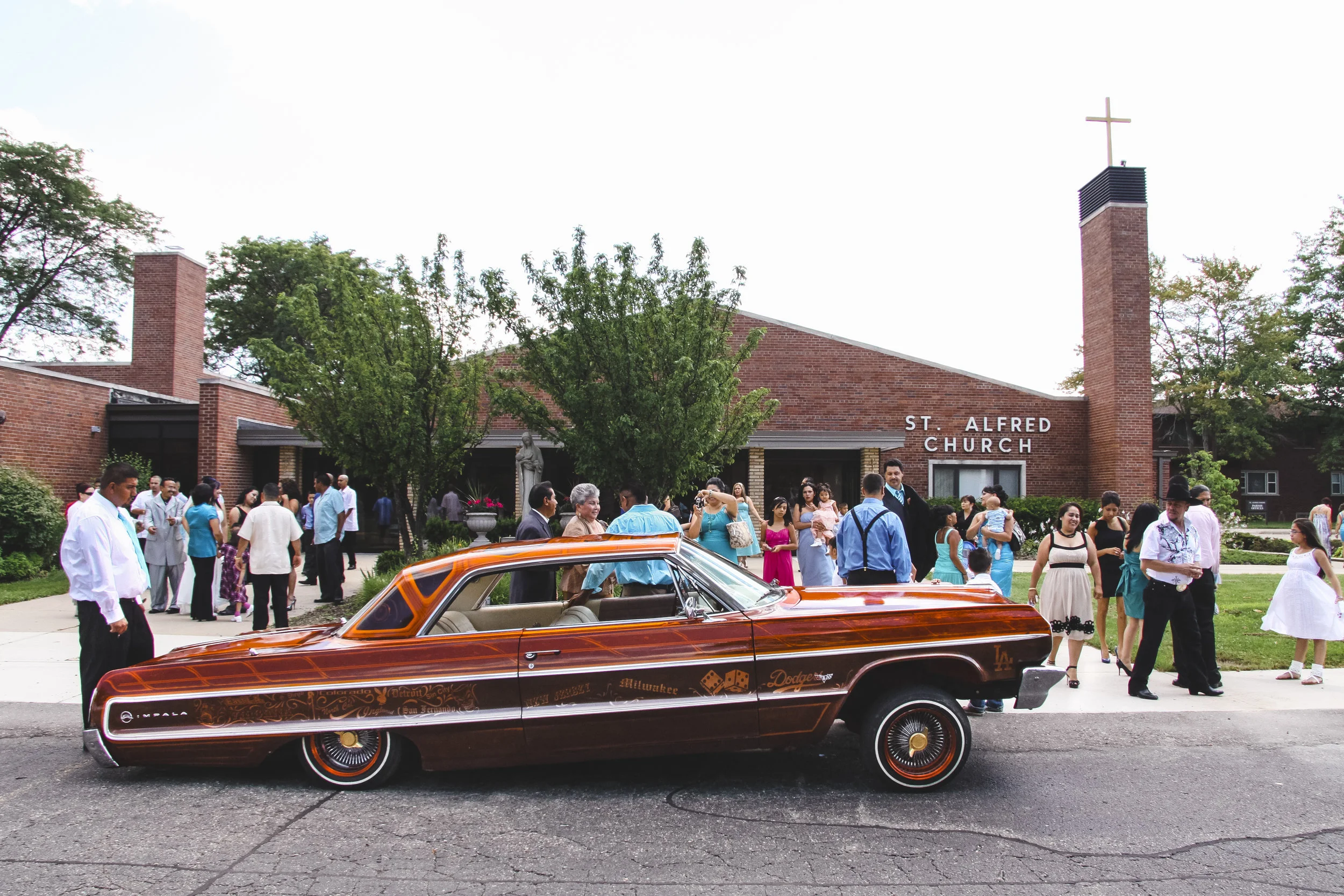 Maria and Abel moved from East Los Angeles to Detroit in 1998 when he started GoodTimes Car Club’s Detroit chapter. Abel’s 64 Impala sits outside the church at their wedding at St Alfred’s, Taylor, MI. (2010)