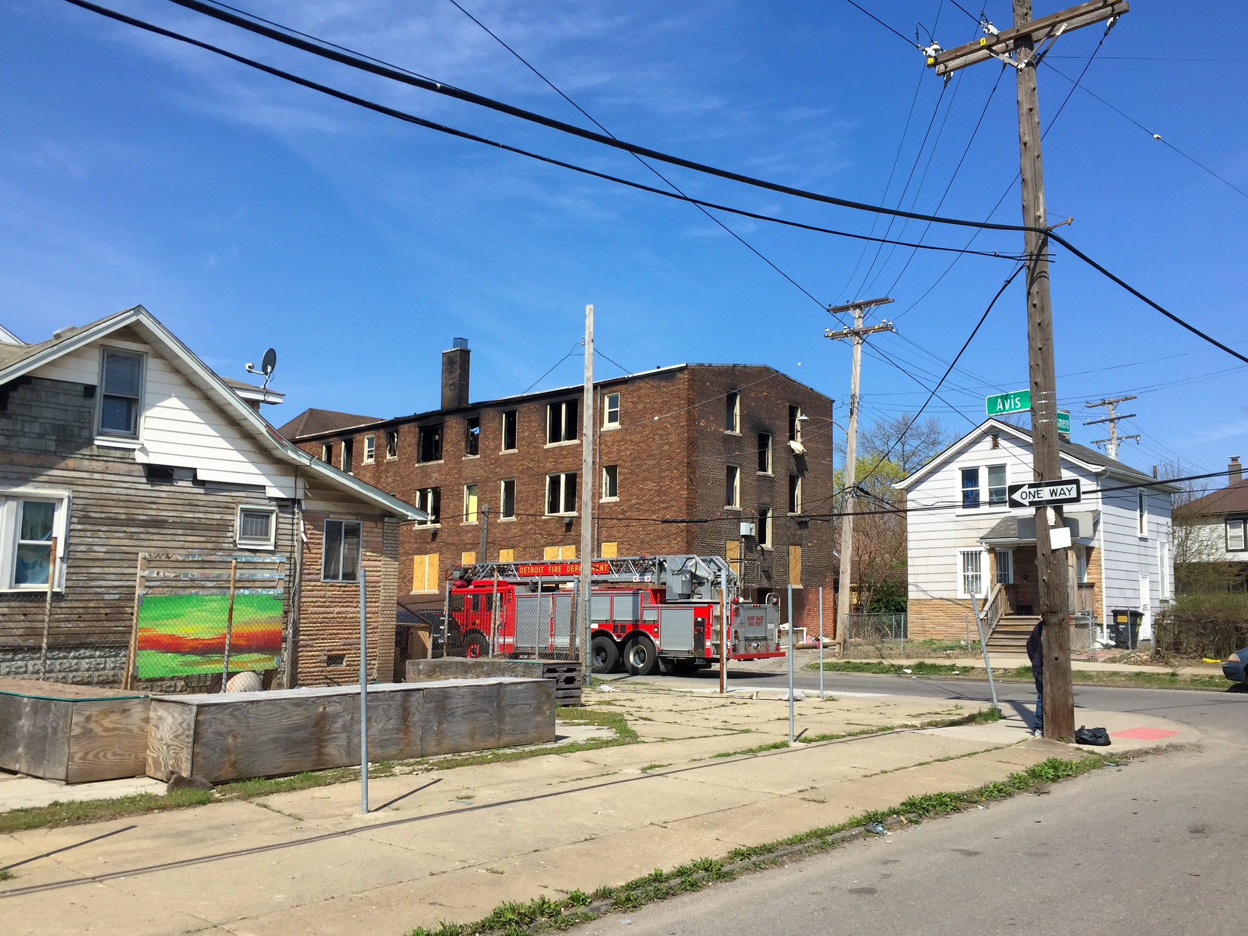The morning began heavy. It was with the realization as I turned the corner that the apartment building across the street from our building and plaza project on Avis and Elsmere suffered significant damage from a fire last night that continued to reignite throughout the morning.