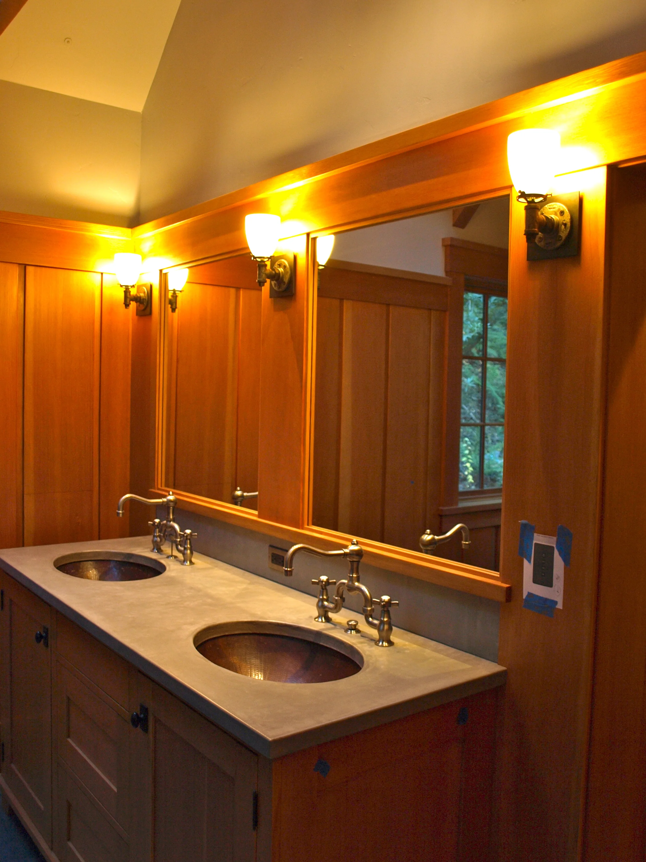 Industrial sconces in Lafayette, CA bathroom/ Mark Becker Architects