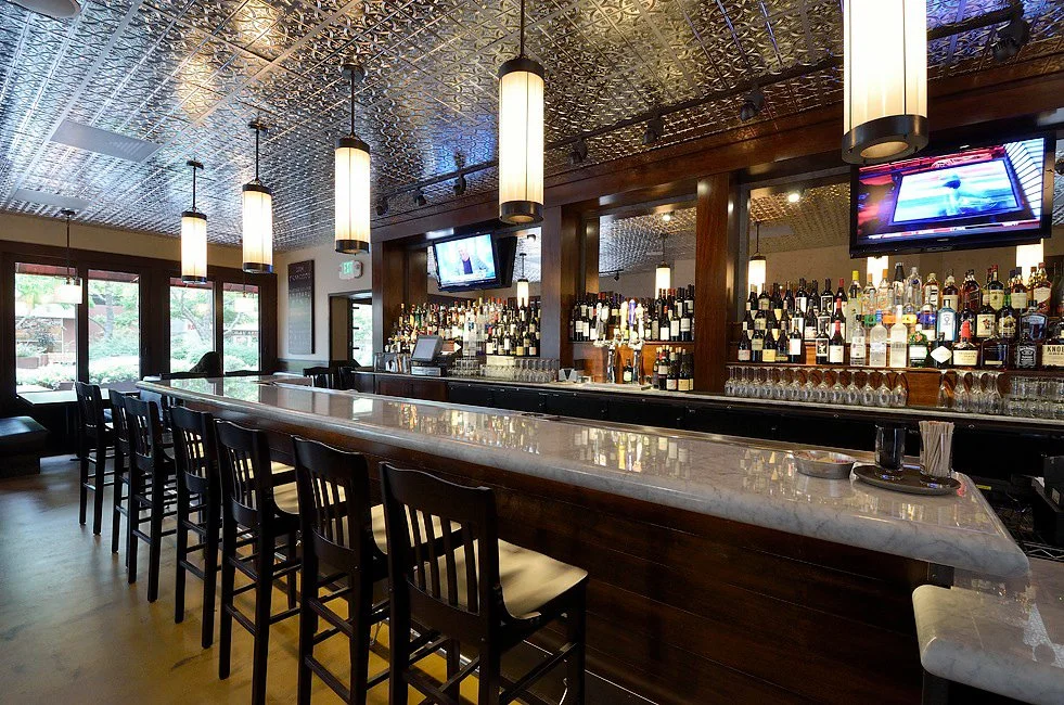 Incandescent fluorescent tube pendants Patxi's restaurant- Lafayette, CA/ Architects 2
