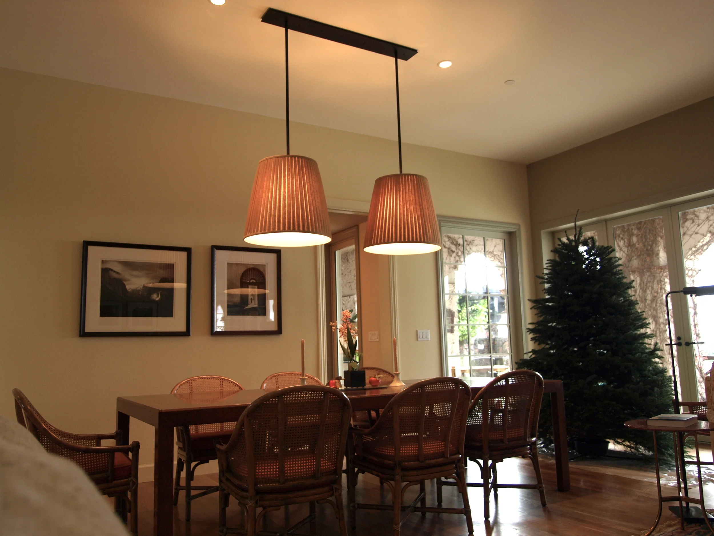 Two lamp pendant with pleated pumpkin colored linen shades/ Stacy Stone Interior Design
