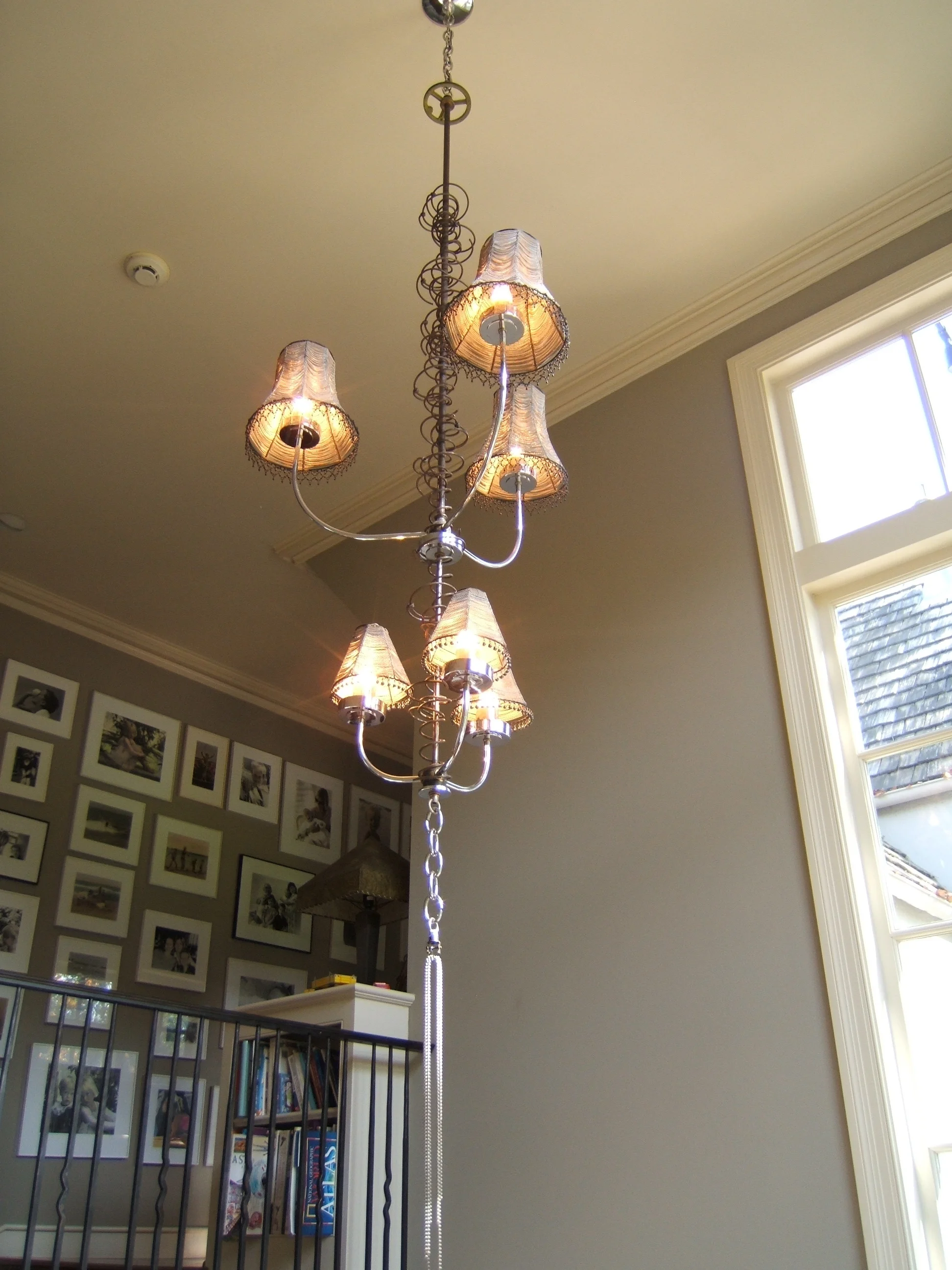 Six beaded shades and bedspring coils over staircase/ Turner Martin Interior Design