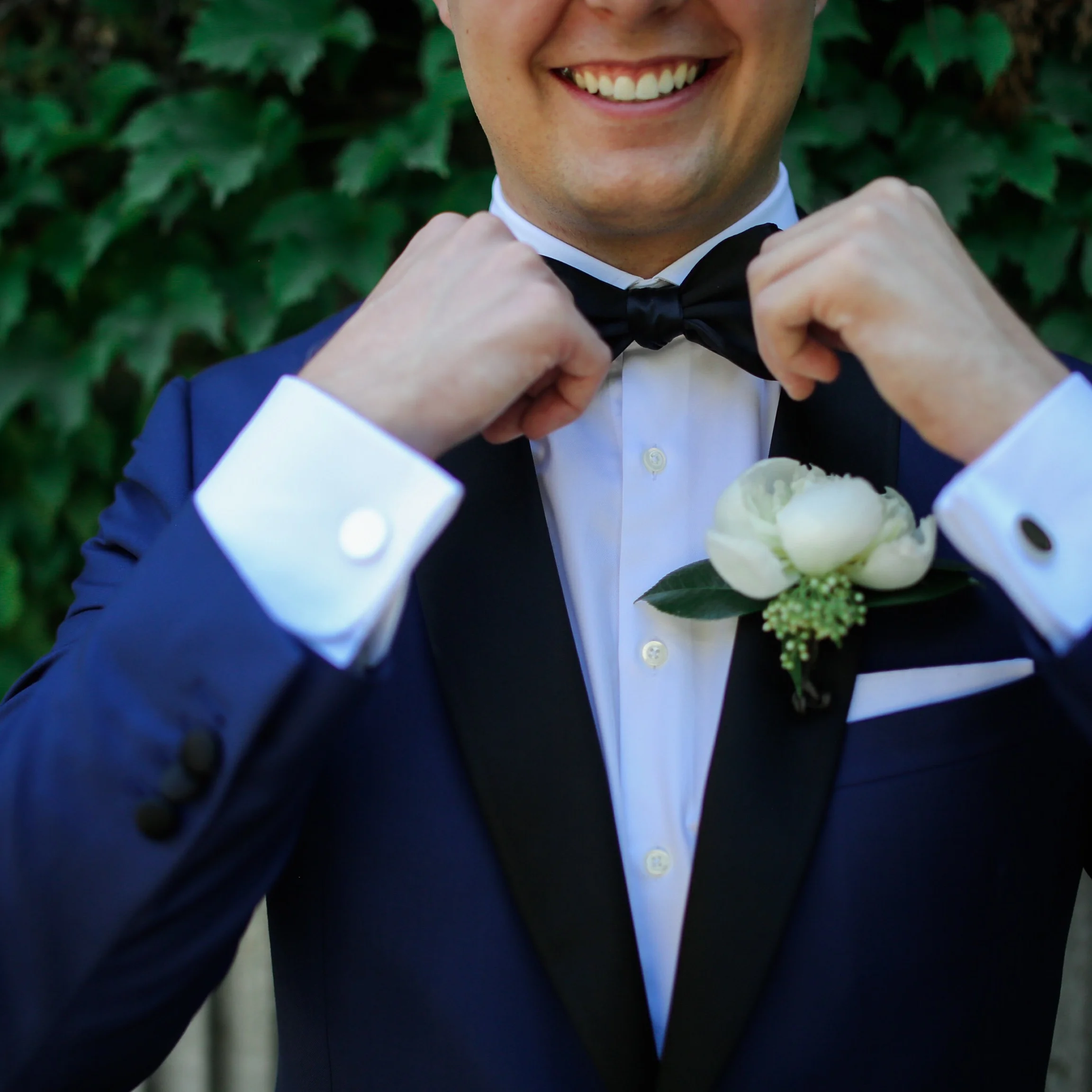 dapper groom with peonie boutonierre