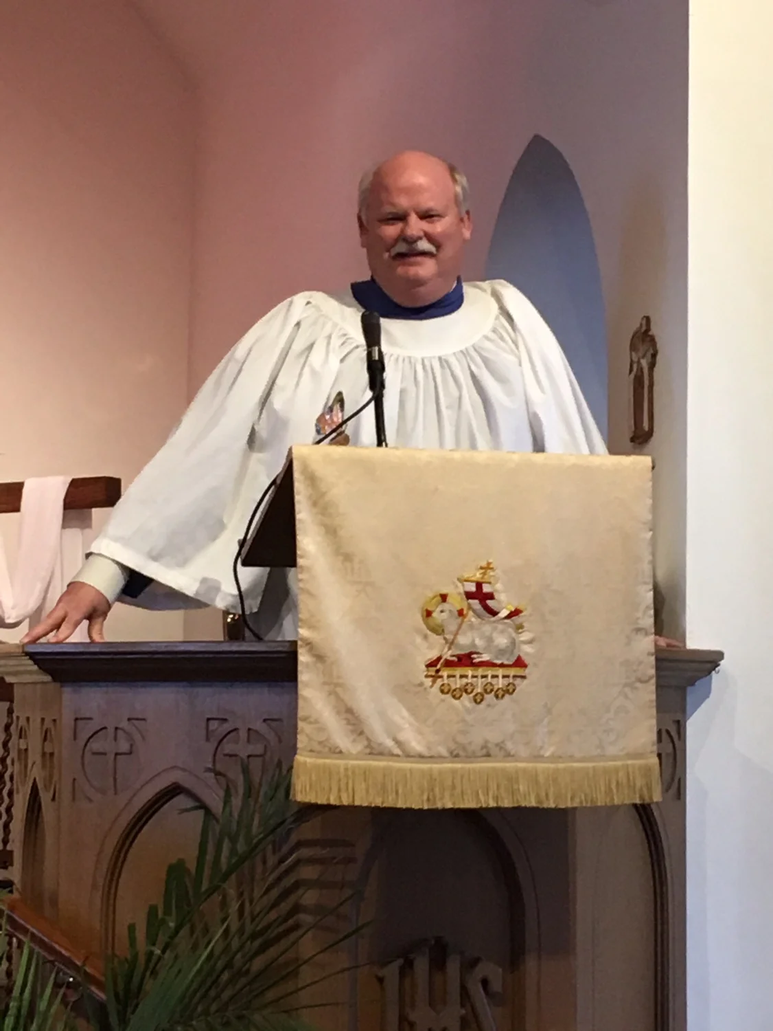 John preaches in choir robe.JPG