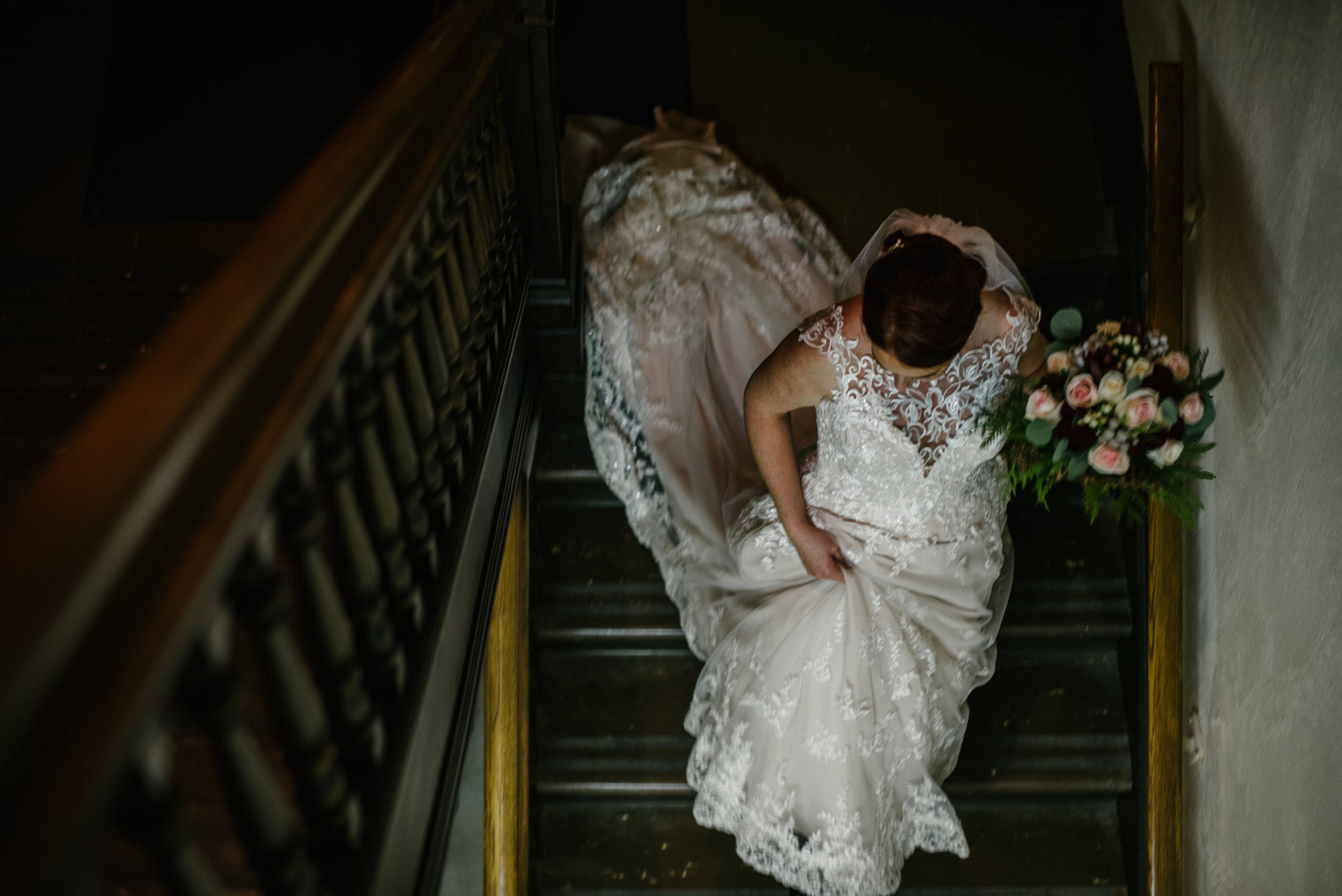 bride going downstairs embrase.jpg