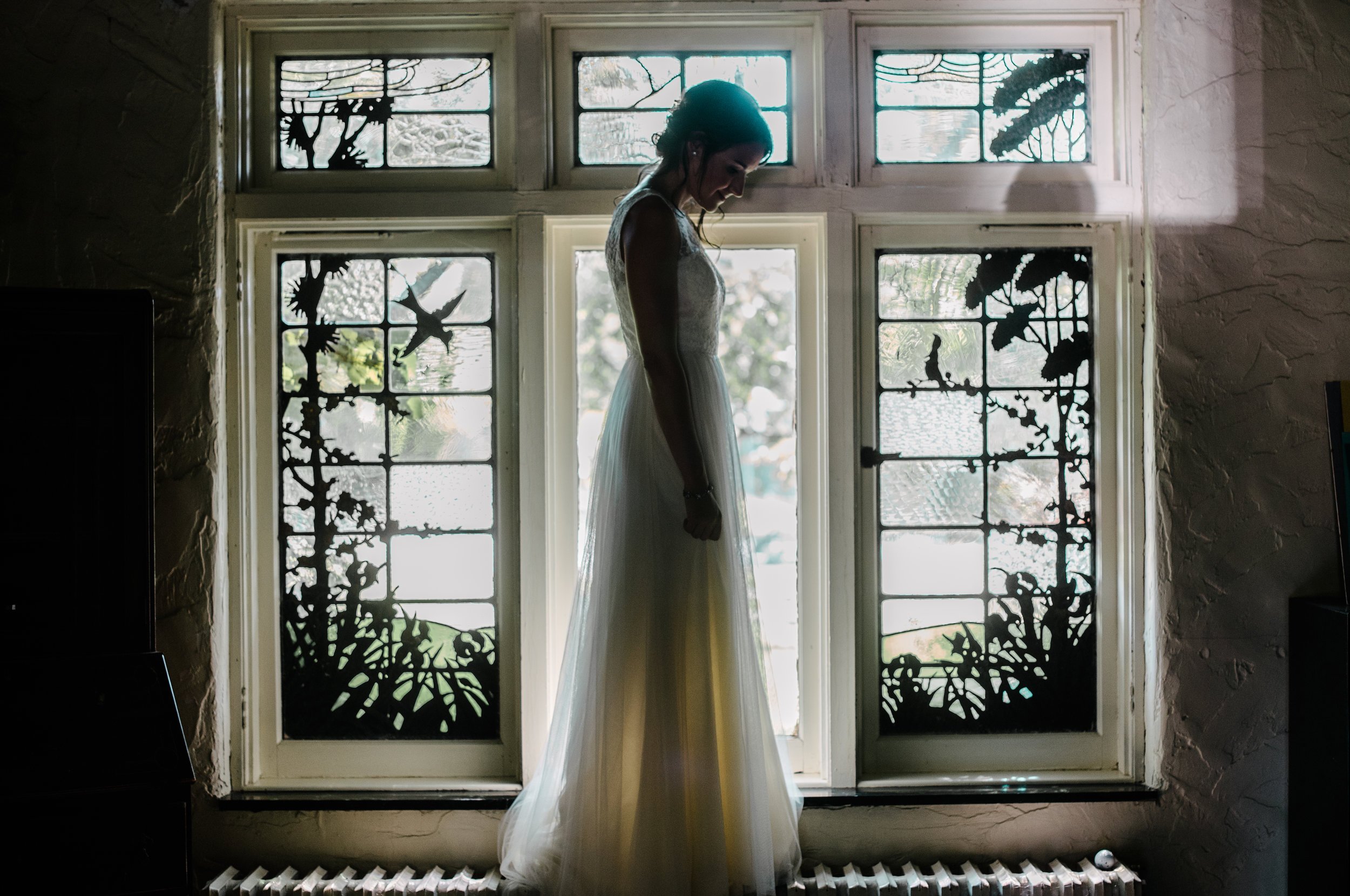 bride standing in window embrase.jpg