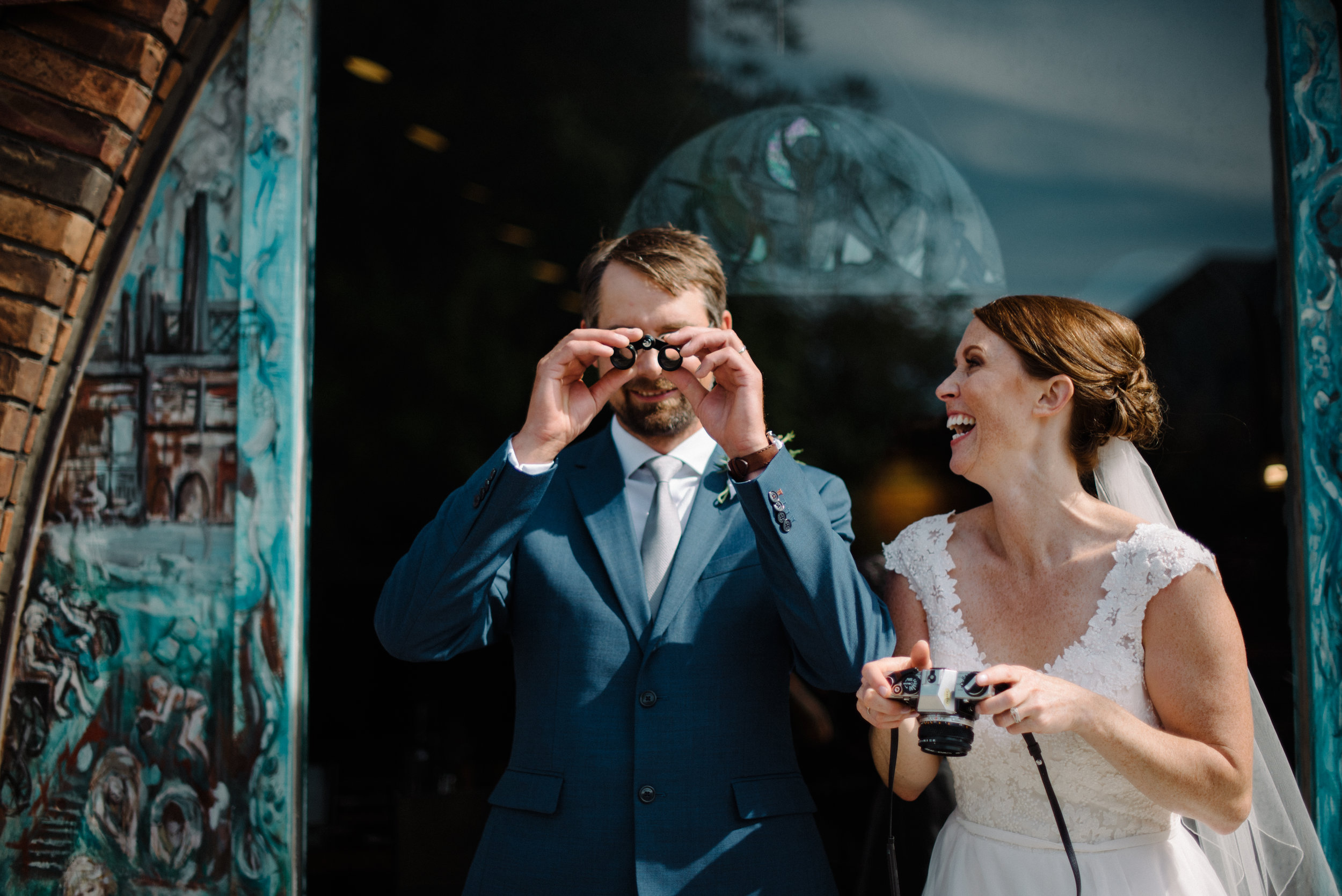 bride and groom with props wedding photography.jpg